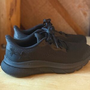 Black HOVR sneakers by Under Armour